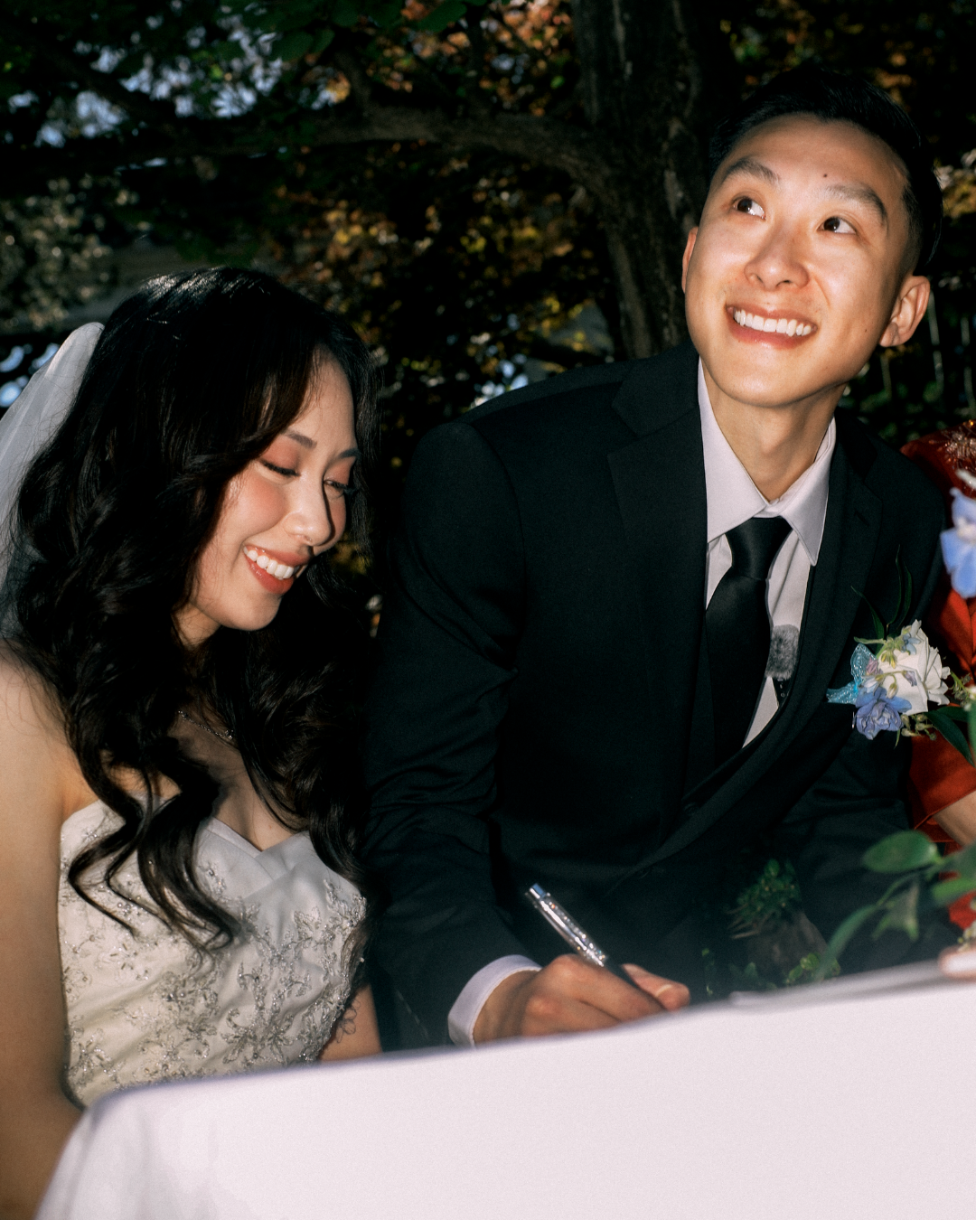A&A signing the marriage register at their wedding